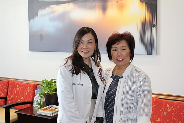 Jing Zhou, M.S.N. and Sue Lee before the start of a yoga class at UT Physicians - Southwest.