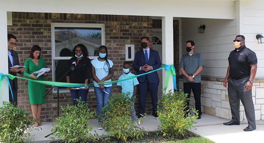 ribbon-cutting for new home
