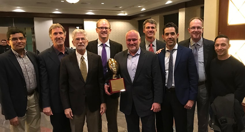 Walter Lowe, M.D. (center) accepted the Jerry “Hawk” Rhea award as the NFL’s most outstanding team physician by the Professional Football Athletic Trainers Society. (Photo by Geoff Kaplan ATC, PT, SCS, CSCS, Sr. Director of Sports Medicine & Head Athletic Trainer.)