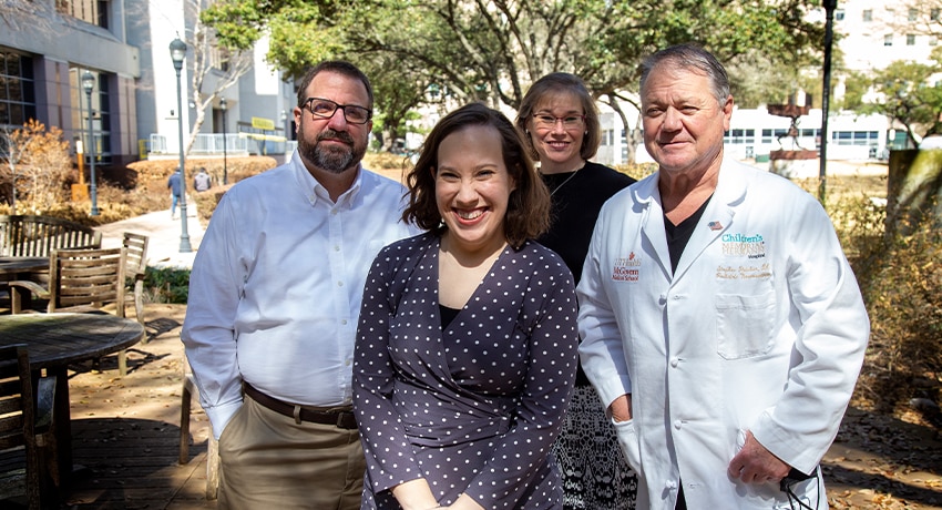 Alexis Shelly and her parents with Stephen Fletcher, DO. (Photo by Cody Duty/UTHealth)