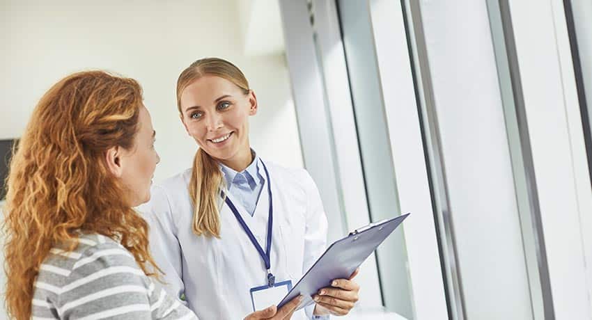 Female doctor discussing treatment plan with a patient