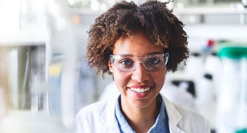 Research doctor wearing safety glasses in a lab