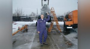 Keith Armstrong next to a plane