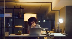 Stressed employee at computer