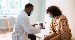 woman meeting with her doctor