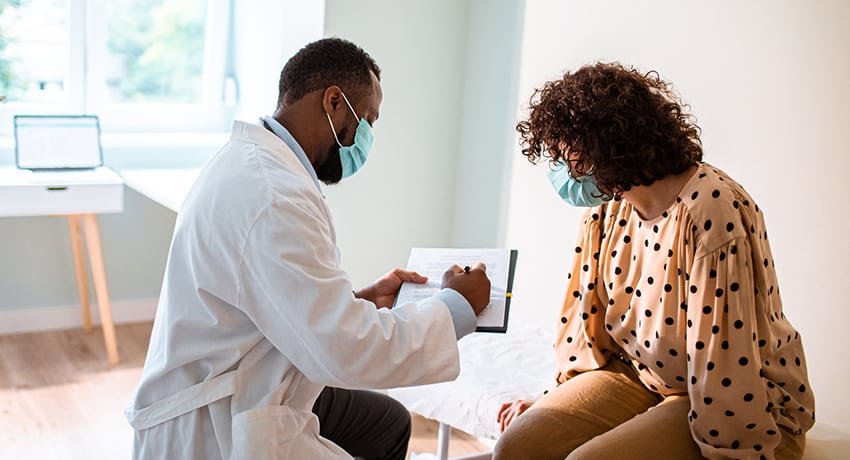 woman meeting with her doctor