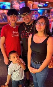 Jordan Gonzales with his three children: Aiden (left), Gissel (right), and Joaquin (middle) (Photo provided by patient