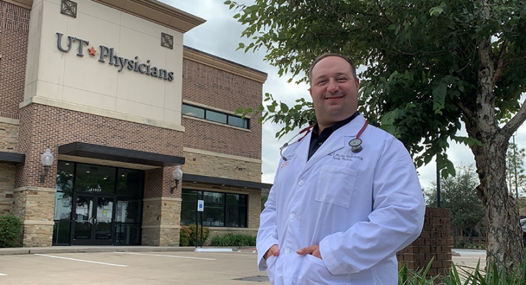 Eric S. Blacher, MD, stands outside clinic