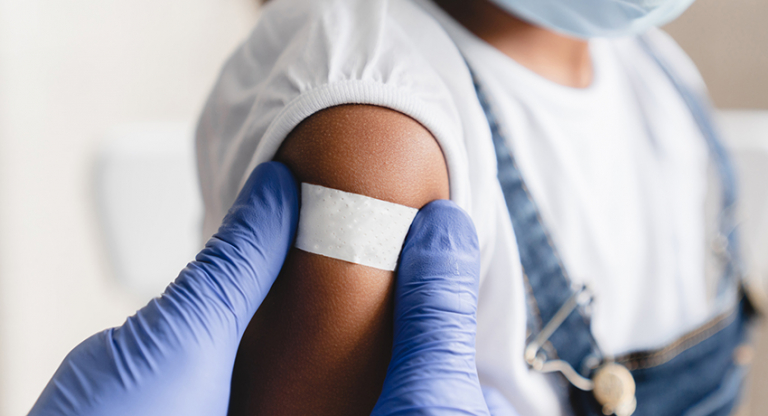 Girl receives measles shot