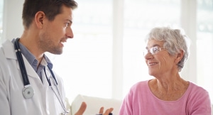 Doctor consulting with female senior patient