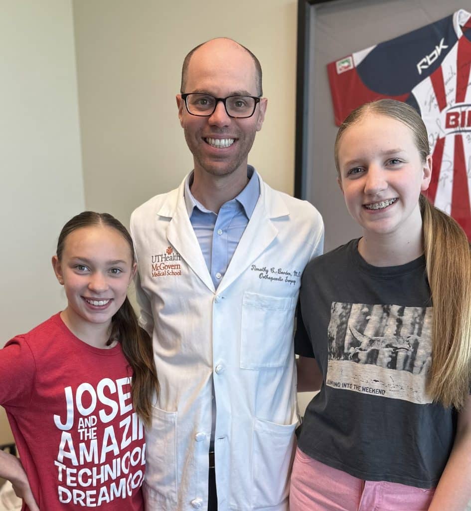 Timothy Borden, MD, and his two scoliosis patients, Ellison and Emily McDonald