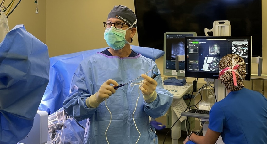 Steven Canfield, MD, performs a focal therapy procedure that uses electrodes to destroy targeted tissue with electrical pulses during prostate cancer surgery. (Photo by UTHealth Houston)