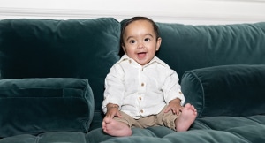 baby sitting on couch