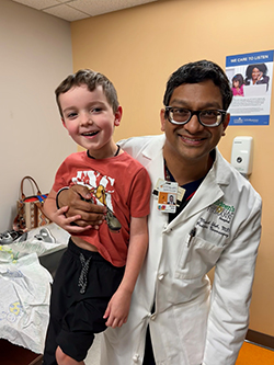 Manish Shah, MD with Brantley two months after his selective dorsal rhizotomy procedure