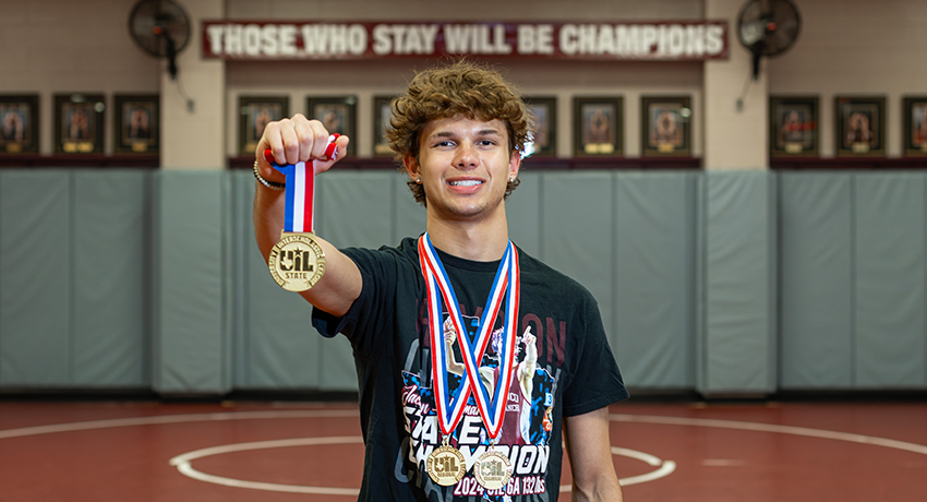 Jackson Herman holding gold medal