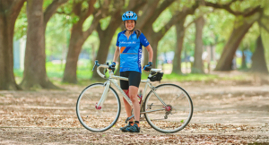 Andrea Bedoy with bike and in full race gear