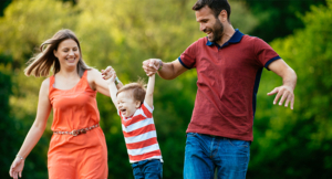 Parents and child being playful outdoors