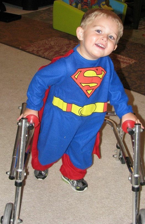 Carter Felix at nearly 3 years old walking with a walker