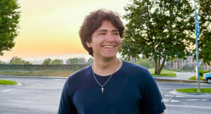 Aidan smiling outside
