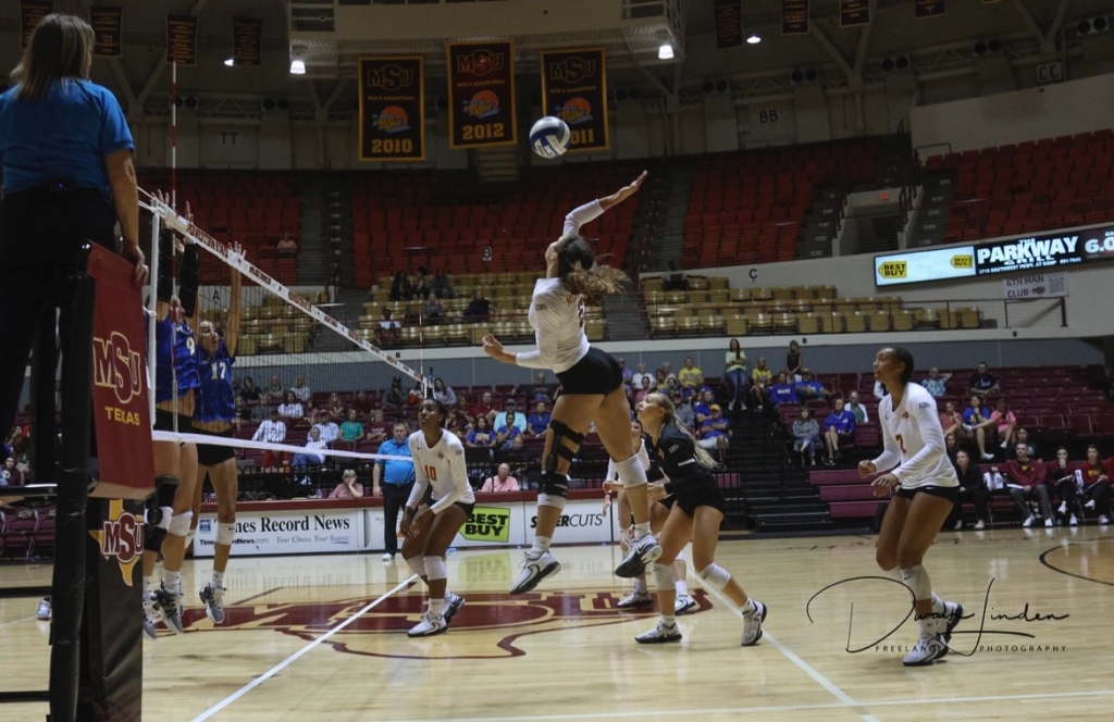 Koryn jumping to hit the volleyball